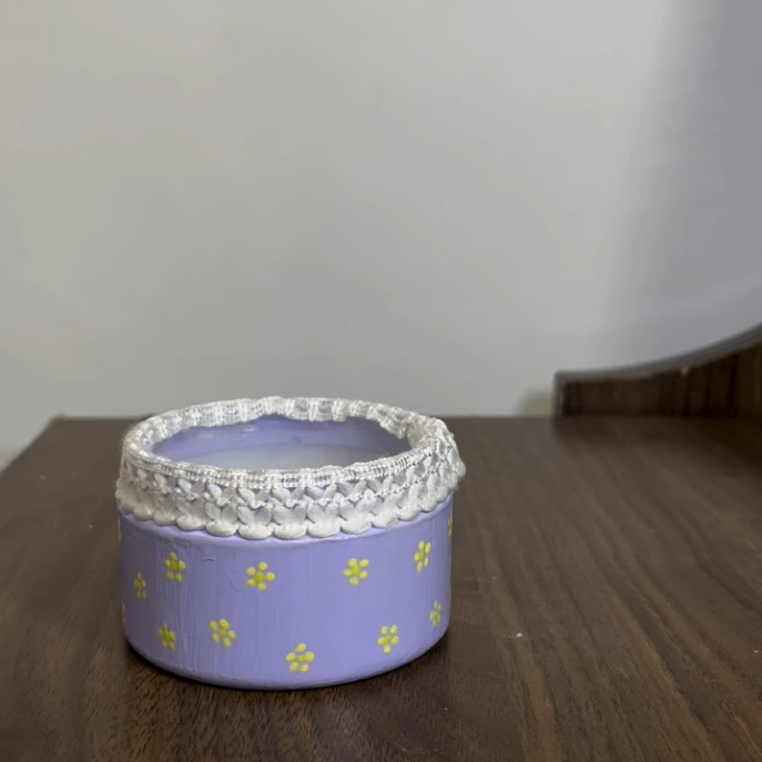 Lavender trinket box with yellow daisies and white braid trim